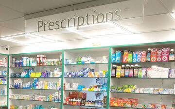 Pharmacy shelves filled with medicines